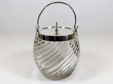 A c.1900 silver plated top glass biscuit barrel