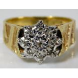 An 18ct gold ring with illusion set diamonds 5.7g