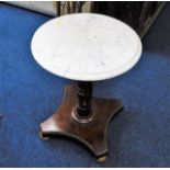 A low level marble topped pedestal table