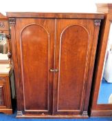 A Victorian mahogany compactum wardrobe 77.25in hi