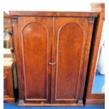 A Victorian mahogany compactum wardrobe 77.25in hi