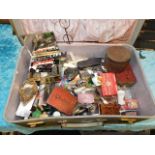 A suitcase full of various sundry items