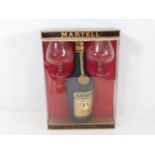 A cased Martell cognac brandy set with two glasses