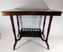 A 20thC. mahogany table with gallery under