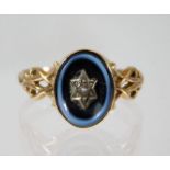 A 19thC. 9ct gold ring with hardstone setting & ce