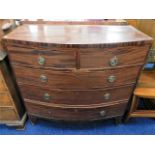 A Georgian bow fronted mahogany chest of drawers (