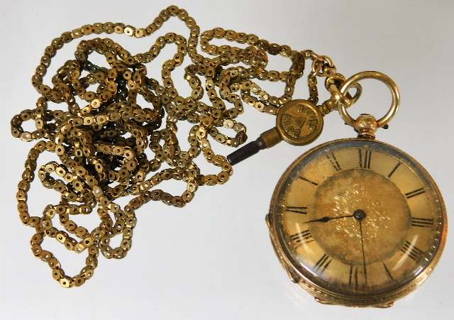 An 18ct gold pocket watch with a gold plated chain