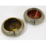 A pair of African style manillas as ashtrays