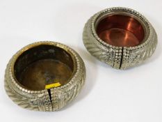 A pair of African style manillas as ashtrays
