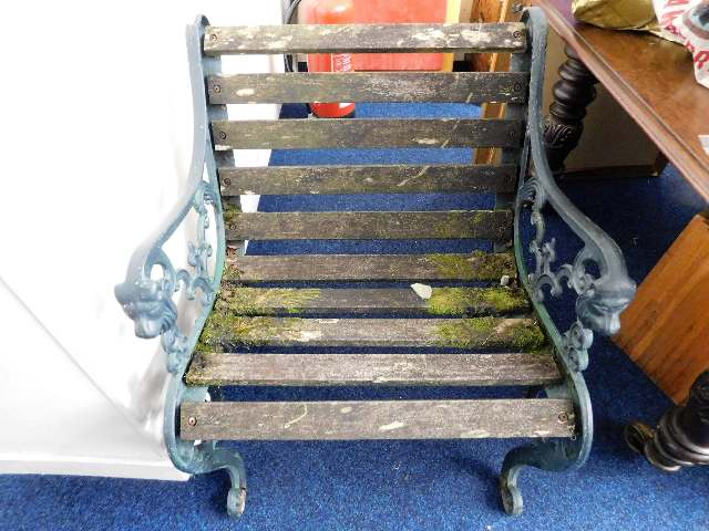 A slatted cast iron garden seat