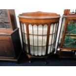 A mahogany D shaped display cabinet