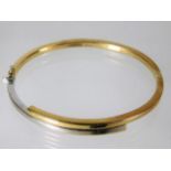 A 9ct two tone gold bangle 7.7g