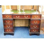 A 20thC. pedestal desk with brass fittings