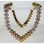 A 14ct gold art deco style necklace set with 4ct d