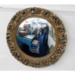 A gilt framed convexed mirror