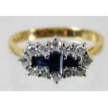 An 18ct gold ring set with diamond & sapphire 3.7g