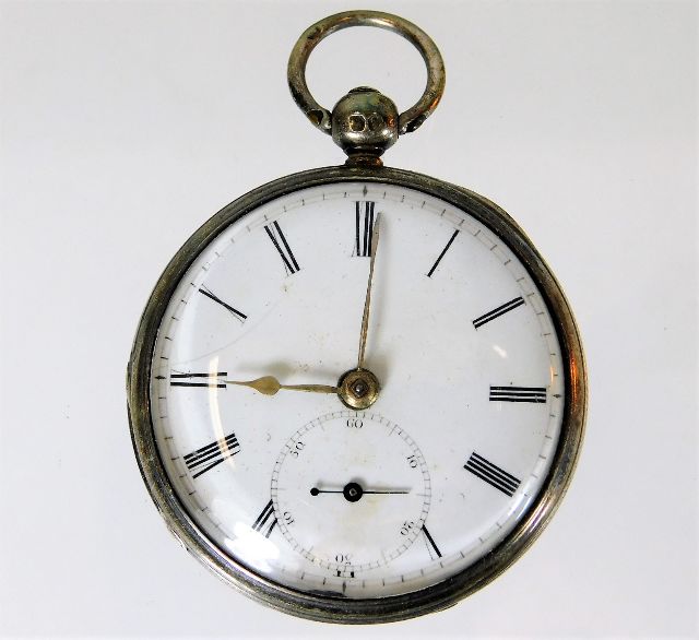 A silver pocket watch not running