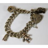 A chunky silver charm bracelet 56g