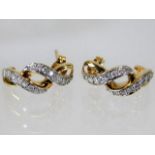 A pair of 9ct gold earrings set with diamonds 2.6g