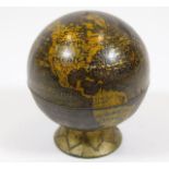 A 1950's globe pencil sharpener