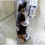 A small Meissen style figure with unusual black cr