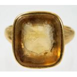 A George III yellow metal ring, tests as gold, set