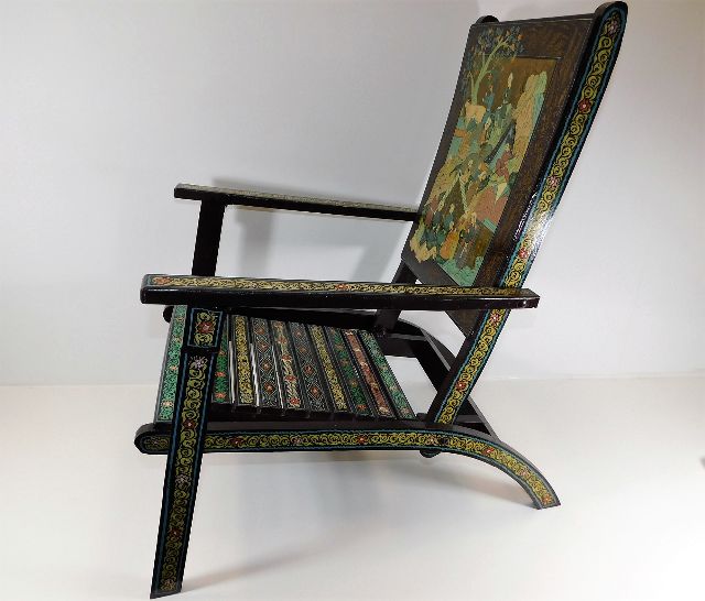 A small folding chair with chinoiserie decor