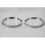 An 18ct white gold pair of earrings set with diamo