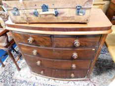 A Victorian bow front chest of drawers