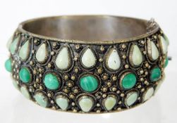 A Chinese white metal bangle set with malachite &