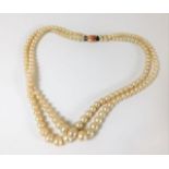 A double string set of Ciro faux pearls with 9ct g