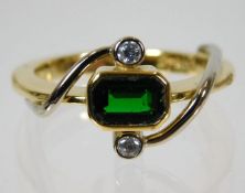 An 18ct gold ring set with green garnet & diamonds