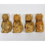Four early Oriental carved bone cat figures