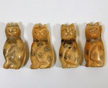 Four early Oriental carved bone cat figures