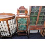 A small mahogany china display cabinet