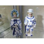A pair of porcelain nodding head dolls