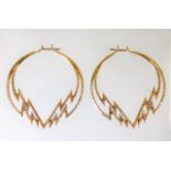 A pair of 18ct gold earrings set with approx. 3ct