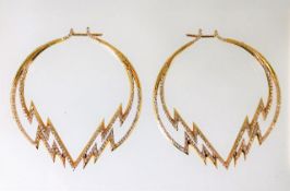 A pair of 18ct gold earrings set with approx. 3ct