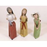 Three Lladro figures of ladies, tallest 9.25in high, one with loss to bow on cap