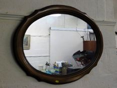A modern oval shaped mirror