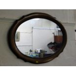 A modern oval shaped mirror