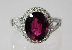 A 9ct white gold ring set with garnet 3.3g size O