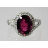 A 9ct white gold ring set with garnet 3.3g size O