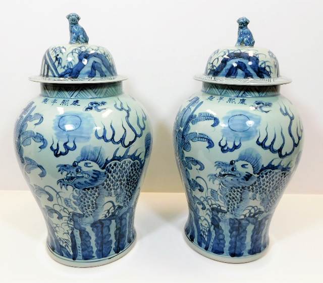 A large pair of decorative Chinese lidded urns