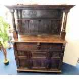 A 17thC. carved oak dresser with green man decor