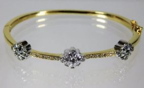 A 14ct gold bangle set with diamonds 22.5g