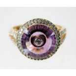 A 9ct gold ring set with amethyst & diamond 4g