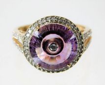 A 9ct gold ring set with amethyst & diamond 4g