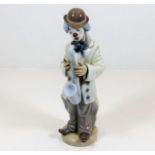 A Lladro clown with saxophone figure gloss finish