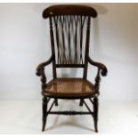 A c.1900 armchair with cane seat & twist stick bac